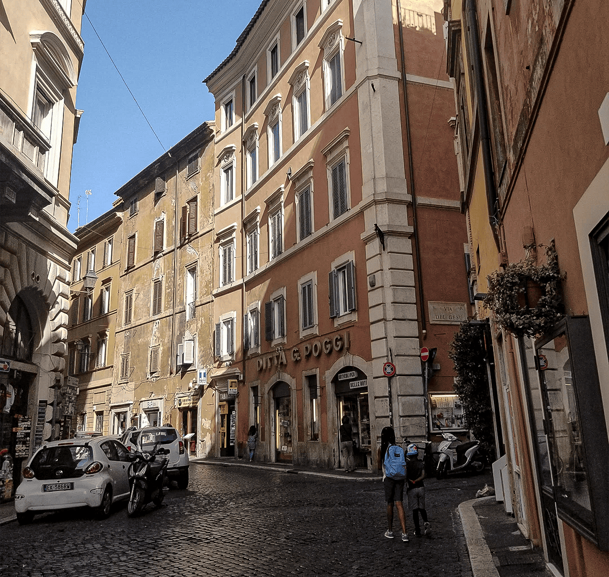 kids walking a side street in Rome, Italy