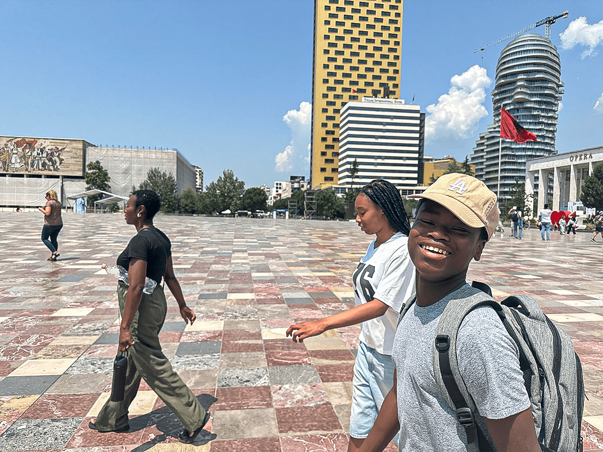 family walking across Skanderbeg Square in Tirana, Albania